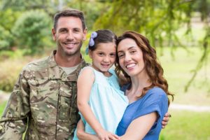 Soldier reunited with family on a sunny day
